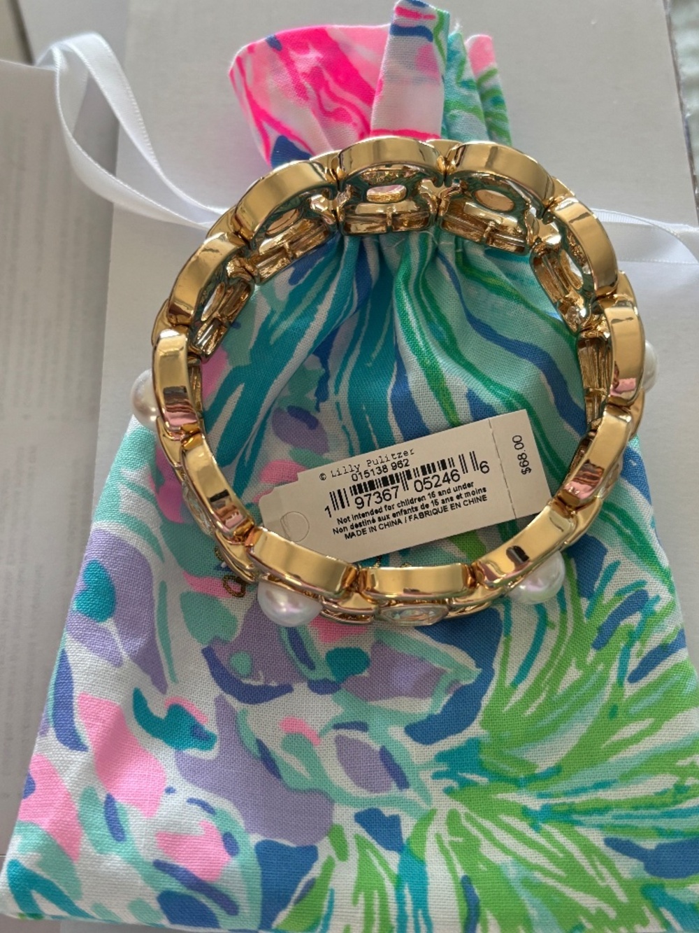 Lilly Pulitzer, gold and gemstone bangle bracelet with pouch